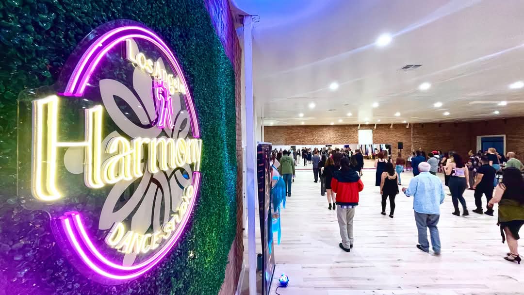 Harmony Dance Studio LA interior with neon sign and open dance floor in Westlake, Los Angeles